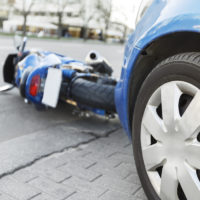 Accident motorcycle and cars on  road