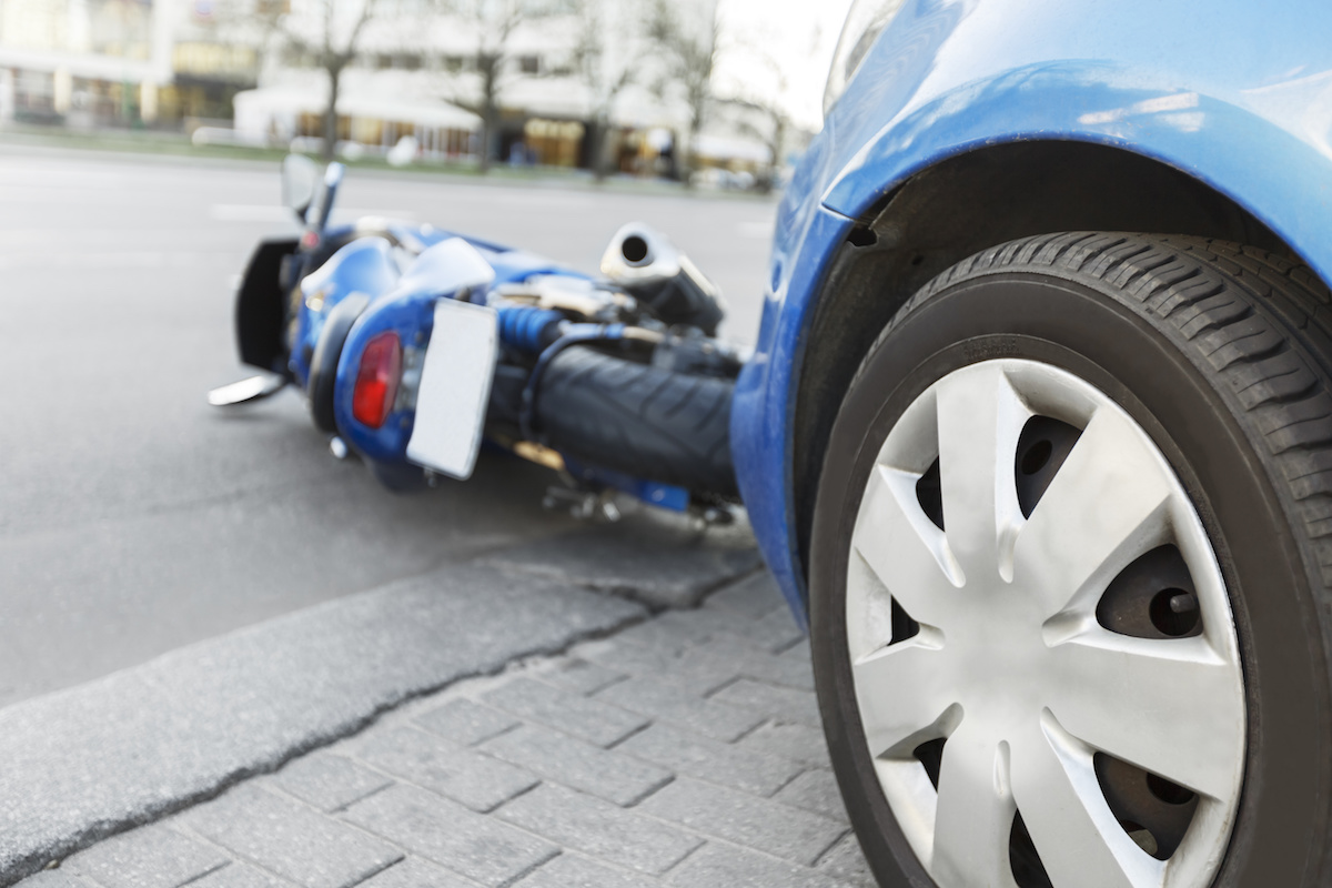 Accident motorcycle and cars on  road
