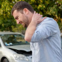 Man suffering Whiplash Man suffering Whiplash