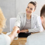 Lady attorney shaking hands with her client Lady attorney shaking hands with her client