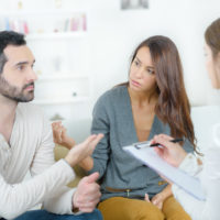 stressed young couple quarrel at the psychologist stressed young couple quarrel at the psychologist