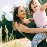 Mother holding special needs child Mother holding special needs child