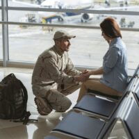 Soldier situating opposite his spouse and promising to come back home alive Soldier situating opposite his spouse and promising to come back home alive