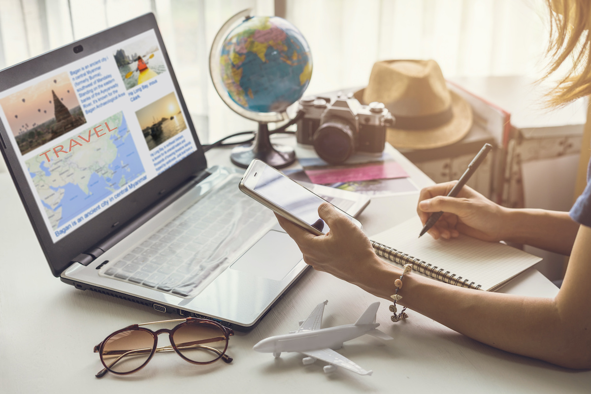 woman planning vacation trip and searching information