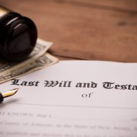 Last will and testament form with gavel. Decision, financial close up Last will and testament form with gavel. Decision, financial close up