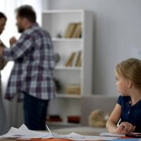 Parents fighting at home, child growing in conflicts and aggression, divorce